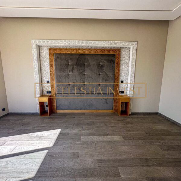 Elegant empty room with traditional Moroccan fireplace.