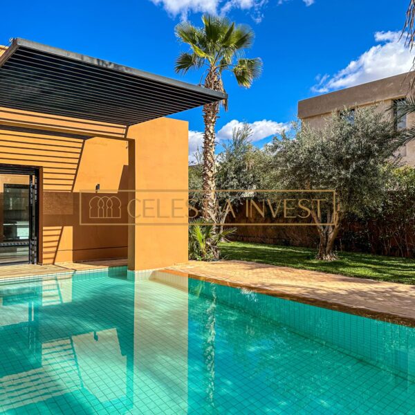 Outdoor pool area with pergola and lush garden in luxury villa