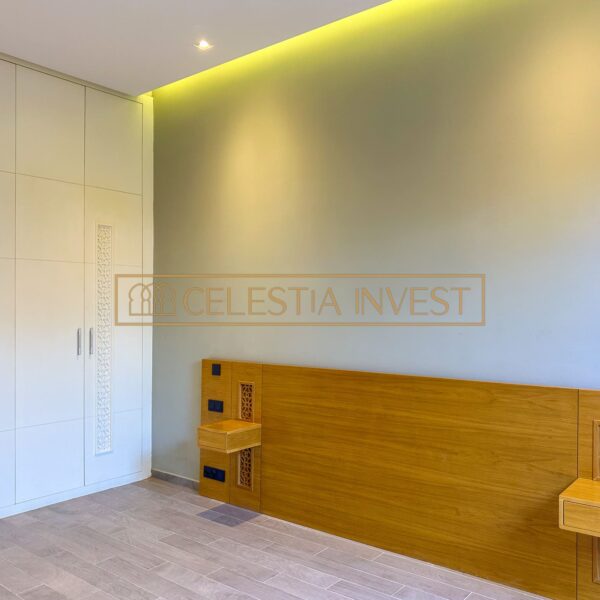 Inviting entrance hall with built-in storage and wood details