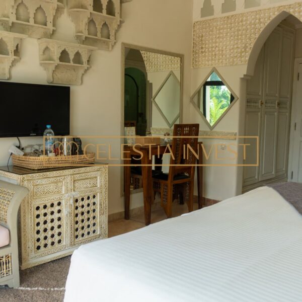 Guest house with rooms featuring Moorish architectural details.