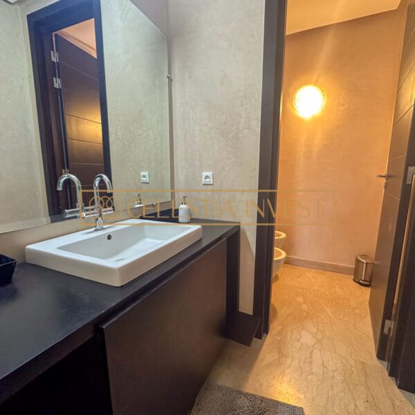 A spa-like bathroom with double sinks, bathtub and walk-in shower, offering a luxurious, revitalizing experience.