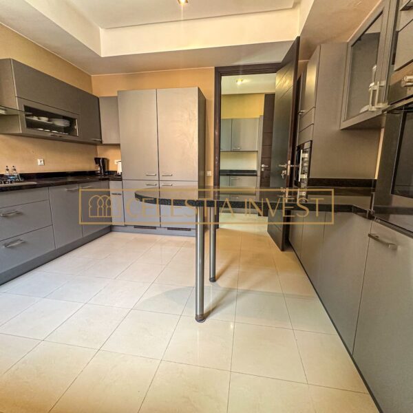 A gourmet kitchen with top-of-the-range appliances, granite worktops and plenty of storage space, ideal for cooking enthusiasts.