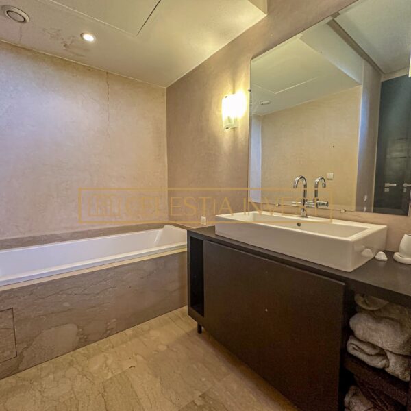 A spa-like bathroom with double sinks, bathtub and walk-in shower, offering a luxurious, revitalizing experience.